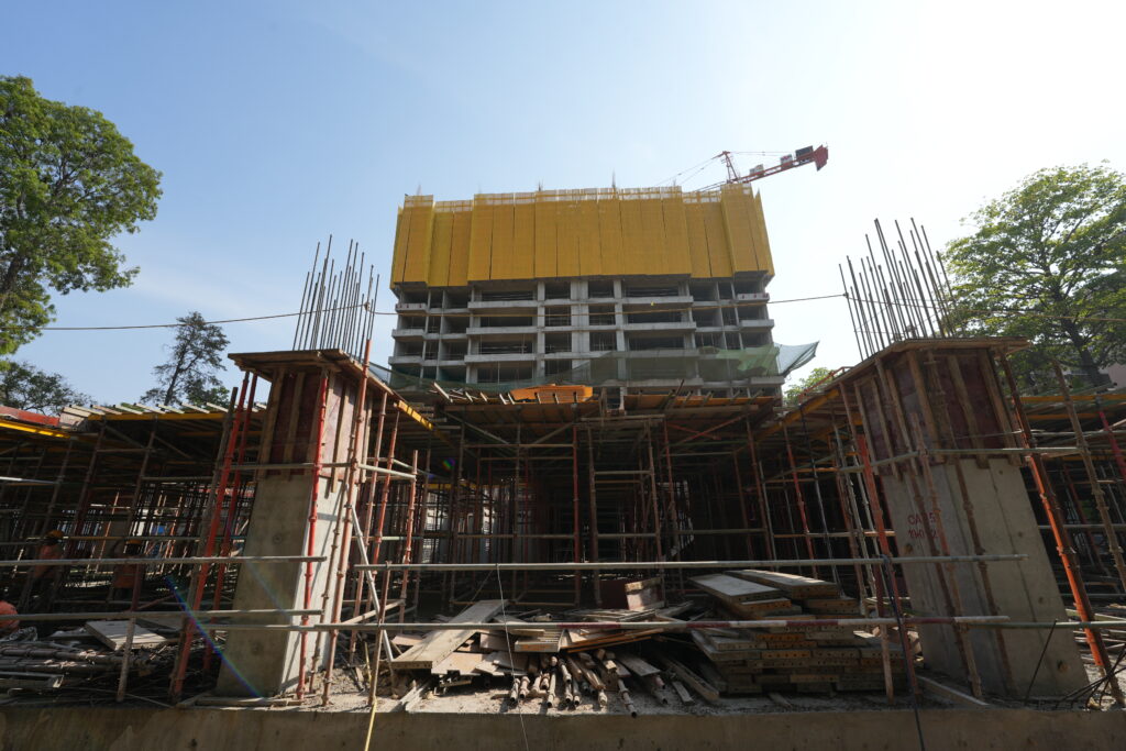 Modern construction site in india using advance construction equipments.